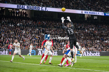 2024-02-04 - Andriy Lunin of Real Madrid seen in action with the ball during the La Liga EA Sports 2023/24 football match between Real Madrid vs Atletico Madrid at Santiago Bernabeu stadium in Madrid, Spain. - REAL MADRID VS ATLETICO MADRID - SPANISH LA LIGA - SOCCER