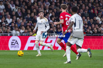 2024-02-04 - Federico Valverde of Real Madrid seen in action with the ball during the La Liga EA Sports 2023/24 football match between Real Madrid vs Atletico Madrid at Santiago Bernabeu stadium in Madrid, Spain. - REAL MADRID VS ATLETICO MADRID - SPANISH LA LIGA - SOCCER