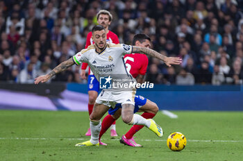 2024-02-04 - Jose Luis Sanmartin Mato (Joselu) of Real Madrid seen in action with the ball during the La Liga EA Sports 2023/24 football match between Real Madrid vs Atletico Madrid at Santiago Bernabeu stadium in Madrid, Spain. - REAL MADRID VS ATLETICO MADRID - SPANISH LA LIGA - SOCCER