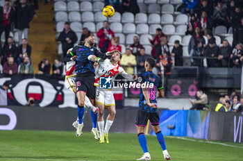 2024-02-05 - Yousseff En Nesyri of Sevilla (C) seen in action with the ball against Alfonso Espino (L) and Pep Chavarria (R) during the La Liga EA Sports 2023/24 football match between Rayo Vallecano vs Sevilla at Estadio Vallecas in Madrid, Spain. - RAYO VALLECANO VS SEVILLA - SPANISH LA LIGA - SOCCER
