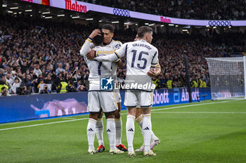 2024-02-10 - Vinicius Junior (L) of Real Madrid seen celebrating his goal with Jude Bellingham (C) and Federico Valverde (R) of Real Madrid during the La Liga EA Sports 2023/24 football match between Real Madrid vs Girona Madrid at Santiago Bernabeu stadium in Madrid, Spain. - REAL MADRID VS GIRONA - SPANISH LA LIGA - SOCCER