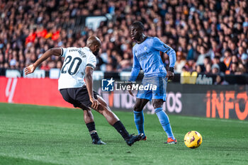 2024-03-03 - Ferland Mendy of Real Madrid and Dimitri Foulquier of Valencia during the Spanish championship Liga football match between Valencia CF and Real Madrid CF on March 2, 2024 at Mestalla stadium in Valencia, Spain - FOOTBALL - SPANISH CHAMP - VALENCIA V REAL MADRID - SPANISH LA LIGA - SOCCER