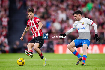 2024-03-03 - Benat Prados of Athletic Club competes for the ball with Pedri Gonzalez of FC Barcelona during the Spanish championship La Liga football match between Athletic Club and FC Barcelona on March 3, 2024 at San Mames in Bilbao, Spain - FOOTBALL - SPANISH CHAMP - ATHLETIC CLUB V FC BARCELONA - SPANISH LA LIGA - SOCCER