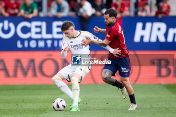 2024-03-16 - Fede Valverde of Real Madrid CF competes for the ball with Ruben Garcia of CA Osasuna during the Spanish championship La Liga football match between CA Osasuna and Real Madrid CF on March 16, 2024 at San Mames stadium in Pamplona, Spain - FOOTBALL - SPANISH CHAMP - OSASUNA V REAL MADRID - SPANISH LA LIGA - SOCCER
