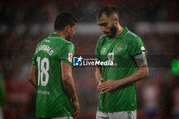2024-03-31 - German Pezzella (Betis) and Pablo Fornals (Betis) during a La Liga EA Sports match between Girona FC and Real Betis at Estadio Municipal de Montilivi, in Girona, ,Spain on March 31, 2024. Photo by Felipe Mondino - GIRONA FC - REAL BETIS - SPANISH LA LIGA - SOCCER