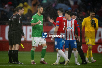 2024-03-31 - Guido Rodriguez (Betis) and Miguel (Girona FC) during a La Liga EA Sports match between Girona FC and Real Betis at Estadio Municipal de Montilivi, in Girona, ,Spain on March 31, 2024. Photo by Felipe Mondino - GIRONA FC - REAL BETIS - SPANISH LA LIGA - SOCCER