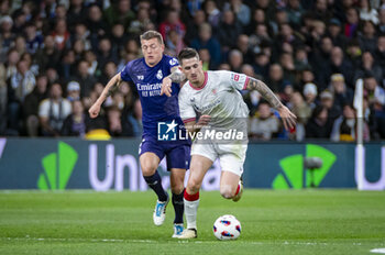 2024-03-31 - Oihan Sancet of Athletic Bilbao (R) seen in action against Toni Kroos of Real Madrid (L) during the La Liga EA Sports 2023/24 football match between Real Madrid vs Athletic Club Bilbao at Santiago Bernabeu stadium in Madrid, Spain. - REAL MADRID VS ATHLETIC CLUB BILBAO - SPANISH LA LIGA - SOCCER