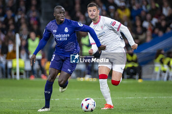 2024-03-31 - Ferland Mendy of Real Madrid (L) fight for the ball against Dani Vivian of Athletic Bilbao (R) during the La Liga EA Sports 2023/24 football match between Real Madrid vs Athletic Club Bilbao at Santiago Bernabeu stadium in Madrid, Spain. - REAL MADRID VS ATHLETIC CLUB BILBAO - SPANISH LA LIGA - SOCCER