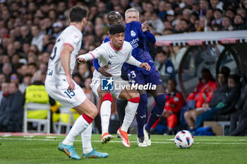 2024-03-31 - Ferland Mendy of Real Madrid (R) fight for the ball against Peru Nolaskoain of Athletic Bilbao (L) during the La Liga EA Sports 2023/24 football match between Real Madrid vs Athletic Club Bilbao at Santiago Bernabeu stadium in Madrid, Spain. - REAL MADRID VS ATHLETIC CLUB BILBAO - SPANISH LA LIGA - SOCCER
