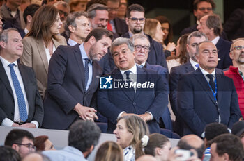 2024-04-21 - MADRID, SPAIN - APRIL 21: Oscar Puente (L), Minister of Transport of the Government of Spain, and Joan Laporta (R), president of FC Barcelona, seen speaking during the La Liga EA Sports 2023/24 football match between Real Madrid vs FC Barcelona at Estadio Santiago Bernabeu on April 21, 2024 in Madrid, Spain. - REAL MADRID VS FC BARCELONA - SPANISH LA LIGA - SOCCER