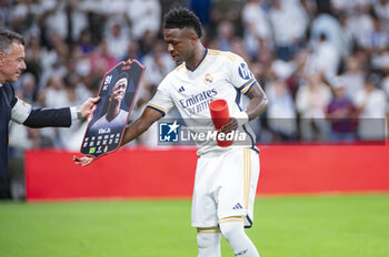 2024-04-21 - MADRID, SPAIN - APRIL 21: Vinicius Junior of Real Madrid seen receiving the trophy as “Best Player of the Month” during the La Liga EA Sports 2023/24 football match between Real Madrid vs FC Barcelona at Estadio Santiago Bernabeu on April 21, 2024 in Madrid, Spain. - REAL MADRID VS FC BARCELONA - SPANISH LA LIGA - SOCCER