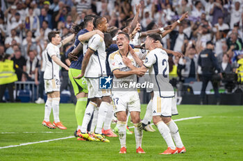 2024-04-21 - MADRID, SPAIN - APRIL 21: Real Madrid and Real Madrid players (from L to R) Eder Militao, Lucas Vazquez, Brahim Diaz, seen celebrating the victory at the end of the La Liga EA Sports 2023/24 football match between Real Madrid vs FC Barcelona at Estadio Santiago Bernabeu on April 21, 2024 in Madrid, Spain. - REAL MADRID VS FC BARCELONA - SPANISH LA LIGA - SOCCER