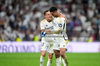 2024-04-21 - Jude Bellingham and Lucas Vazquez of Real Madrid celebrate the 3-2 victory during the Spanish championship La Liga football match between Real Madrid and FC Barcelona on April 21, 2024 at Santiago Bernabeu stadium in Madrid, Spain - FOOTBALL - SPANISH CHAMP - REAL MADRID V FC BARCELONA - SPANISH LA LIGA - SOCCER