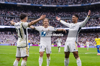 2024-05-04 - MADRID, SPAIN - MAY 04: Brahim Diaz (L), Luka Modric (C) and Jude Bellingham (R) of Real Madrid seen celebrating a goal during the La Liga EA Sports 2023/24 football match between Real Madrid vs Cadiz CF at Estadio Santiago Bernabeu on May 04, 2024 in Madrid, Spain. - REAL MADRID VS CADIZ - SPANISH LA LIGA - SOCCER