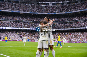 2024-05-04 - MADRID, SPAIN - MAY 04: Brahim Diaz (C), Luka Modric (L) and Jude Bellingham (R) of Real Madrid seen celebrating a goal during the La Liga EA Sports 2023/24 football match between Real Madrid vs Cadiz CF at Estadio Santiago Bernabeu on May 04, 2024 in Madrid, Spain. - REAL MADRID VS CADIZ - SPANISH LA LIGA - SOCCER