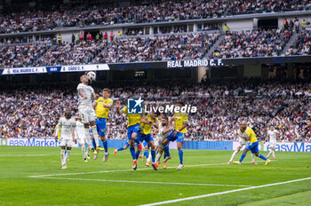 2024-05-04 - MADRID, SPAIN - MAY 04: Eder Militao of Real Madrid (L) heads the ball during the La Liga EA Sports 2023/24 football match between Real Madrid vs Cadiz CF at Estadio Santiago Bernabeu on May 04, 2024 in Madrid, Spain. - REAL MADRID VS CADIZ - SPANISH LA LIGA - SOCCER