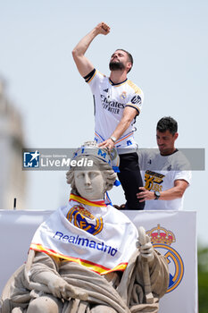 2024-05-12 - Nacho Fernandez celebrates on top of the fountain during the celebration of Real Madrid at Plaza de Cibeles for their 36th Championship Title of the Spanish League on May 12, 2024 in Madrid, Spain - FOOTBALL - REAL MADRID CELEBRATES SPANISH LEAGUE TITLE - SPANISH LA LIGA - SOCCER