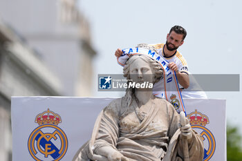 2024-05-12 - Nacho Fernandez celebrates on top of the fountain during the celebration of Real Madrid at Plaza de Cibeles for their 36th Championship Title of the Spanish League on May 12, 2024 in Madrid, Spain - FOOTBALL - REAL MADRID CELEBRATES SPANISH LEAGUE TITLE - SPANISH LA LIGA - SOCCER