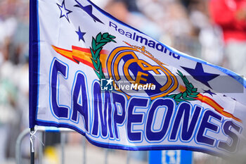2024-05-12 - A supporting flag is seen during the celebration of Real Madrid at Plaza de Cibeles for their 36th Championship Title of the Spanish League on May 12, 2024 in Madrid, Spain - FOOTBALL - REAL MADRID CELEBRATES SPANISH LEAGUE TITLE - SPANISH LA LIGA - SOCCER