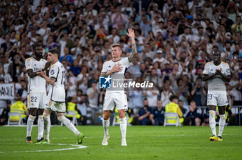 2024-05-25 - Toni Kroos of Real Madrid (C) seen cheering the fans while his teammates celebrate him at the end of the La Liga EA Sports 2023/24 football match between Real Madrid vs Real Betis at Estadio Santiago Bernabeu on May 25, 2024 in Madrid, Spain. - REAL MADRID VS REAL BETIS - SPANISH LA LIGA - SOCCER