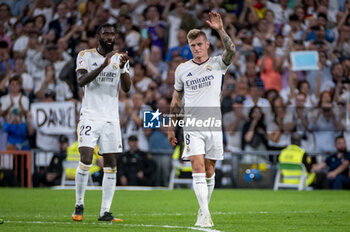 2024-05-25 - Toni Kroos of Real Madrid (C) seen cheering the fans while his teammates celebrate him at the end of the La Liga EA Sports 2023/24 football match between Real Madrid vs Real Betis at Estadio Santiago Bernabeu on May 25, 2024 in Madrid, Spain. - REAL MADRID VS REAL BETIS - SPANISH LA LIGA - SOCCER