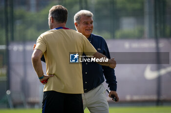 2024-07-19 - Head Coach Hans Flick (FC Barcelona) and FC Barcelona president Joan Laporta during a FC Barcelona training session at Ciutat Esportiva Joan Gamper in Barcelona, Spain, on July 19 2024. Photo by Felipe Mondino - FC BARCLEONA TRAINING SESSION - SPANISH LA LIGA - SOCCER