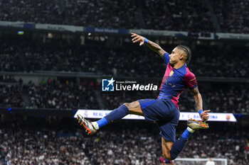 2024-10-26 - Raphael Dias "Raphinha" of FC Barcelona celebrates a goal 0-4 during the Spanish championship La Liga football match between Real Madrid CF and FC Barcelona on 26 October 2024 at Santiago Bernabeu stadium in Madrid, Spain - FOOTBALL - SPANISH CHAMP - REAL MADRID V FC BARCELONA - SPANISH LA LIGA - SOCCER