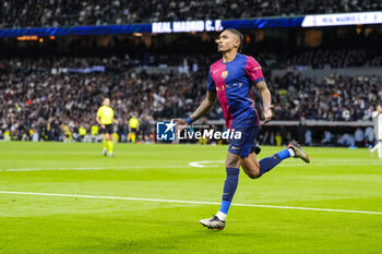 2024-10-26 - Raphael Dias "Raphinha" of FC Barcelona celebrates a goal 0-4 during the Spanish championship La Liga football match between Real Madrid CF and FC Barcelona on 26 October 2024 at Santiago Bernabeu stadium in Madrid, Spain - FOOTBALL - SPANISH CHAMP - REAL MADRID V FC BARCELONA - SPANISH LA LIGA - SOCCER