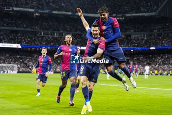 2024-10-26 - Robert Lewandowski of FC Barcelona celebrates a goal with Lamine Yamal during the Spanish championship La Liga football match between Real Madrid CF and FC Barcelona on 26 October 2024 at Santiago Bernabeu stadium in Madrid, Spain - FOOTBALL - SPANISH CHAMP - REAL MADRID V FC BARCELONA - SPANISH LA LIGA - SOCCER