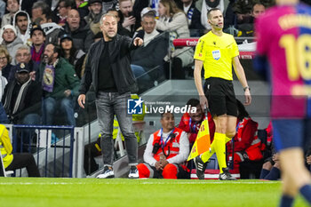 2024-10-26 - Hansi Flick, head coach of FC Barcelona during the Spanish championship La Liga football match between Real Madrid CF and FC Barcelona on 26 October 2024 at Santiago Bernabeu stadium in Madrid, Spain - FOOTBALL - SPANISH CHAMP - REAL MADRID V FC BARCELONA - SPANISH LA LIGA - SOCCER