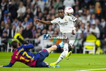 2024-10-26 - Vinicius Junior of Real Madrid and Marc Casado of FC Barcelona during the Spanish championship La Liga football match between Real Madrid CF and FC Barcelona on 26 October 2024 at Santiago Bernabeu stadium in Madrid, Spain - FOOTBALL - SPANISH CHAMP - REAL MADRID V FC BARCELONA - SPANISH LA LIGA - SOCCER