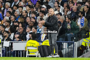 2024-10-26 - Hansi Flick, head coach of FC Barcelona during the Spanish championship La Liga football match between Real Madrid CF and FC Barcelona on 26 October 2024 at Santiago Bernabeu stadium in Madrid, Spain - FOOTBALL - SPANISH CHAMP - REAL MADRID V FC BARCELONA - SPANISH LA LIGA - SOCCER