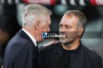 2024-10-26 - Hansi Flick, head coach of FC Barcelona and Carlo Ancelotti, head coach of Real Madrid during the Spanish championship La Liga football match between Real Madrid CF and FC Barcelona on 26 October 2024 at Santiago Bernabeu stadium in Madrid, Spain - FOOTBALL - SPANISH CHAMP - REAL MADRID V FC BARCELONA - SPANISH LA LIGA - SOCCER