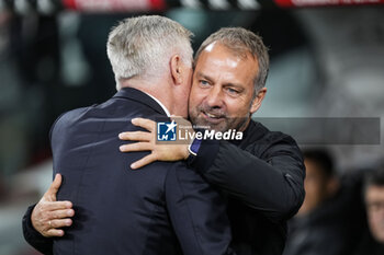 2024-10-26 - Hansi Flick, head coach of FC Barcelona and Carlo Ancelotti, head coach of Real Madrid during the Spanish championship La Liga football match between Real Madrid CF and FC Barcelona on 26 October 2024 at Santiago Bernabeu stadium in Madrid, Spain - FOOTBALL - SPANISH CHAMP - REAL MADRID V FC BARCELONA - SPANISH LA LIGA - SOCCER