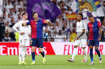 2024-10-26 - Robert Lewandowski of FC Barcelona celebrates a goal during the Spanish championship La Liga football match between Real Madrid CF and FC Barcelona on 26 October 2024 at Santiago Bernabeu stadium in Madrid, Spain - FOOTBALL - SPANISH CHAMP - REAL MADRID V FC BARCELONA - SPANISH LA LIGA - SOCCER