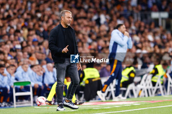 2024-10-26 - Hansi Flick, head coach of FC Barcelona during the Spanish championship La Liga football match between Real Madrid CF and FC Barcelona on 26 October 2024 at Santiago Bernabeu stadium in Madrid, Spain - FOOTBALL - SPANISH CHAMP - REAL MADRID V FC BARCELONA - SPANISH LA LIGA - SOCCER