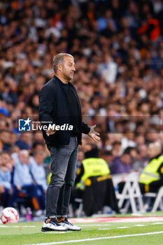 2024-10-26 - Hansi Flick, head coach of FC Barcelona during the Spanish championship La Liga football match between Real Madrid CF and FC Barcelona on 26 October 2024 at Santiago Bernabeu stadium in Madrid, Spain - FOOTBALL - SPANISH CHAMP - REAL MADRID V FC BARCELONA - SPANISH LA LIGA - SOCCER