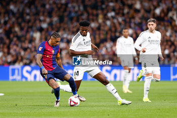 2024-10-26 - Raphinha Dias Belloli of FC Barcelona and Aurelien Tchouameni of Real Madrid during the Spanish championship La Liga football match between Real Madrid CF and FC Barcelona on 26 October 2024 at Santiago Bernabeu stadium in Madrid, Spain - FOOTBALL - SPANISH CHAMP - REAL MADRID V FC BARCELONA - SPANISH LA LIGA - SOCCER