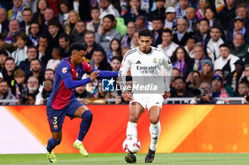 2024-10-26 - Jude Bellingham of Real Madrid and Alejandro Balde of FC Barcelona during the Spanish championship La Liga football match between Real Madrid CF and FC Barcelona on 26 October 2024 at Santiago Bernabeu stadium in Madrid, Spain - FOOTBALL - SPANISH CHAMP - REAL MADRID V FC BARCELONA - SPANISH LA LIGA - SOCCER