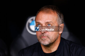 2024-10-26 - Hansi Flick, head coach of FC Barcelona during the Spanish championship La Liga football match between Real Madrid CF and FC Barcelona on 26 October 2024 at Santiago Bernabeu stadium in Madrid, Spain - FOOTBALL - SPANISH CHAMP - REAL MADRID V FC BARCELONA - SPANISH LA LIGA - SOCCER