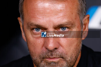 2024-10-26 - Hansi Flick, head coach of FC Barcelona during the Spanish championship La Liga football match between Real Madrid CF and FC Barcelona on 26 October 2024 at Santiago Bernabeu stadium in Madrid, Spain - FOOTBALL - SPANISH CHAMP - REAL MADRID V FC BARCELONA - SPANISH LA LIGA - SOCCER