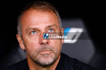 2024-10-26 - Hansi Flick, head coach of FC Barcelona during the Spanish championship La Liga football match between Real Madrid CF and FC Barcelona on 26 October 2024 at Santiago Bernabeu stadium in Madrid, Spain - FOOTBALL - SPANISH CHAMP - REAL MADRID V FC BARCELONA - SPANISH LA LIGA - SOCCER