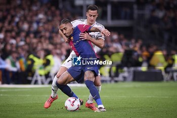 2024-10-26 - Spanish La Liga EA Sports soccer match Real Madrid vs FC Barcelona at Santiago Bernabeu stadium in Madrid, Spain 26 October 2024 Raphinha and Lucas Vazquez 900/Cordon Press - LA LIGA: REAL MADRID VS FC BARCELONA - SPANISH LA LIGA - SOCCER