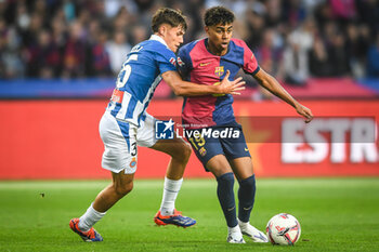 2024-11-03 - Rafel BAUZA of Espanyol Barcelona and Lamine YAMAL of Barcelona during the Spanish championship La Liga football match between FC Barcelona and RCD Espanyol de Barcelona on 3 November 2024 at Estadi Olimpic Lluis Companys in Barcelona, Spain - FOOTBALL - SPANISH CHAMP - BARCELONA V ESPANYOL - SPANISH LA LIGA - SOCCER