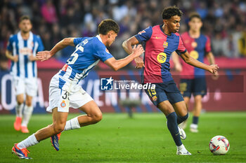 2024-11-03 - Rafel BAUZA of Espanyol Barcelona and Lamine YAMAL of Barcelona during the Spanish championship La Liga football match between FC Barcelona and RCD Espanyol de Barcelona on 3 November 2024 at Estadi Olimpic Lluis Companys in Barcelona, Spain - FOOTBALL - SPANISH CHAMP - BARCELONA V ESPANYOL - SPANISH LA LIGA - SOCCER