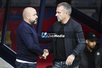 2024-11-03 - Hansi Flick, head coach of FC Barcelona greets Manolo Gonzalez, head coach of RCD Espanyol during the Spanish championship La Liga football match between FC Barcelona and RCD Espanyol on 3 November 2024 at Estadi Olímpic Lluís Companys in Barcelona, Spain - FOOTBALL - SPANISH CHAMP - BARCELONA V ESPANYOL - SPANISH LA LIGA - SOCCER