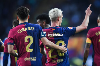 2024-11-03 - Dani OLMO of Barcelona celebrate his goal with Pau CUBARSI of Barcelona during the Spanish championship La Liga football match between FC Barcelona and RCD Espanyol de Barcelona on 3 November 2024 at Estadi Olimpic Lluis Companys in Barcelona, Spain - FOOTBALL - SPANISH CHAMP - BARCELONA V ESPANYOL - SPANISH LA LIGA - SOCCER