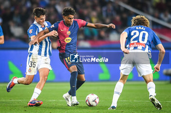 2024-11-03 - Rafel BAUZA of Espanyol Barcelona and Lamine YAMAL of Barcelona during the Spanish championship La Liga football match between FC Barcelona and RCD Espanyol de Barcelona on 3 November 2024 at Estadi Olimpic Lluis Companys in Barcelona, Spain - FOOTBALL - SPANISH CHAMP - BARCELONA V ESPANYOL - SPANISH LA LIGA - SOCCER