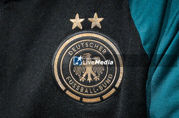 2024-02-22 - Illustration of the official logo of the German women's football team during the press conference on February 22, 2024 prior to the UEFA Women's Nations League 2024, Semi-finals football match between France and Germany on February 23, 2024 at Groupama stadium in Decines-Charpieu near Lyon, France - FOOTBALL - WOMEN'S NATIONS LEAGUE - FRANCE V GERMANY - TRAINING AND PRESS CONFERENCE - UEFA NATIONS LEAGUE - SOCCER