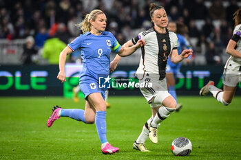 2024-02-23 - Eugenie LE SOMMER of France and Marina HEGERING of Germany during the UEFA Women's Nations League, Semi-final football match between France and Germany on February 23, 2024 at Groupama Stadium in Decines-Charpieu near Lyon, France - FOOTBALL - WOMEN'S NATIONS LEAGUE - FRANCE V GERMANY - UEFA NATIONS LEAGUE - SOCCER